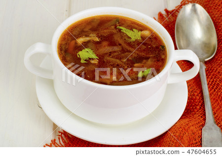 Soup with vegetables on white wooden surface Soup with vegetables on white wooden surface 47604655