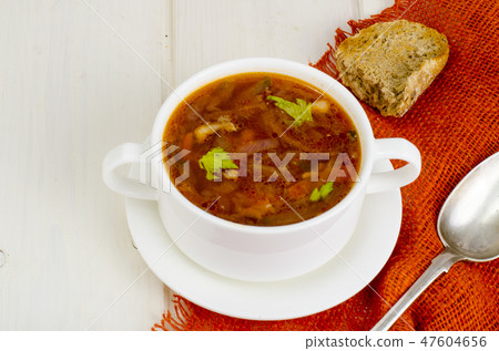 Soup with vegetables on white wooden surface Soup with vegetables on white wooden surface 47604656