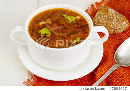 Soup with vegetables on white wooden surface Soup with vegetables on white wooden surface 47604657