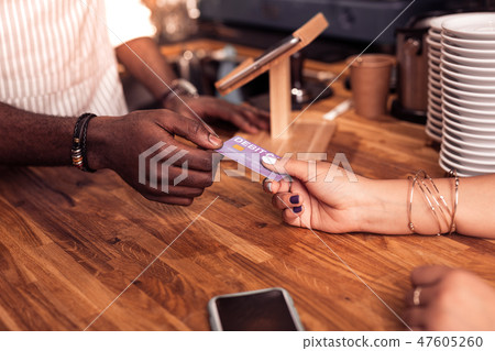 Nice afro American man taking a debit card Nice afro American man taking a debit card 47605260