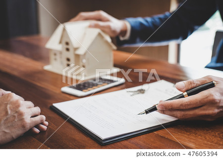 Real estate broker agent presenting and consult to customer to d 47605394