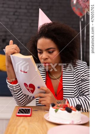 Pleasant good looking woman reading a love story Pleasant good looking woman reading a love story 47605701