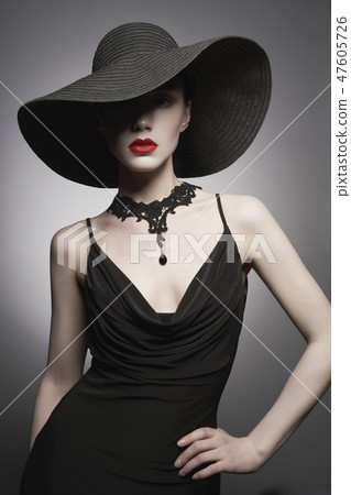 portrait of young lady with black hat and evening dress portrait of young lady with black hat and evening dress 47605726