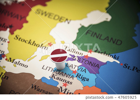 Latvia marked with a flag on the map 47605925