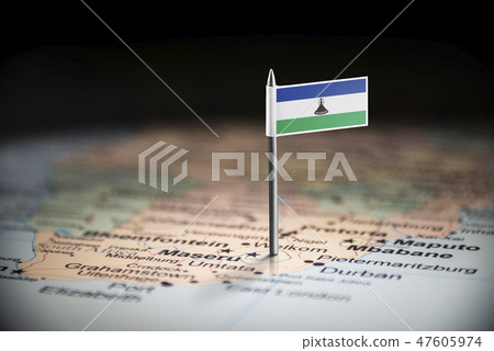 Lesotho marked with a flag on the map 47605974