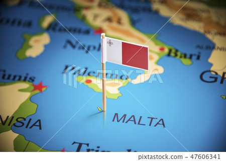 Malta marked with a flag on the map 47606341