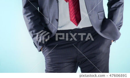 Colorful background. Close-up. Thighs of a man. businessmen cheerfully moves his hips 47606891