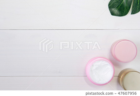 cosmetic and skin care product and green leaves 47607956