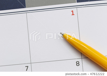 Yellow Pen point to empty space on the calendar background. Yellow Pen point to empty space on the calendar background. 47612222