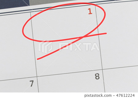 Focus on number 1 in calendar and empty red ellipse. 47612224
