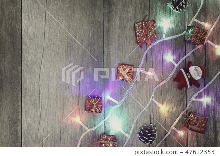 Colorful of Christmas lights on brown wooden floor. Colorful of Christmas lights on brown wooden floor. 47612353