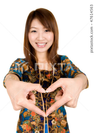 Asian woman hand forming a heart shape Asian woman hand forming a heart shape 47614563