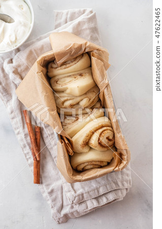 Raw cinnamon bread in a baking dish. Copy space. Raw cinnamon bread in a baking dish. Copy space. 47622465
