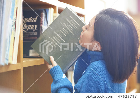 A woman in the library A woman in the library 47623788
