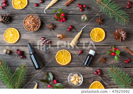 Christmas background with bottles of essential oil 47625092