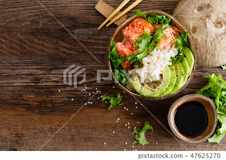 Hawaiian poke coconut bowl with grilled salmon 47625270