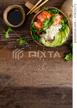 Hawaiian poke coconut bowl with grilled salmon 47625271