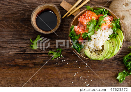 Hawaiian poke coconut bowl with grilled salmon Hawaiian poke coconut bowl with grilled salmon 47625272