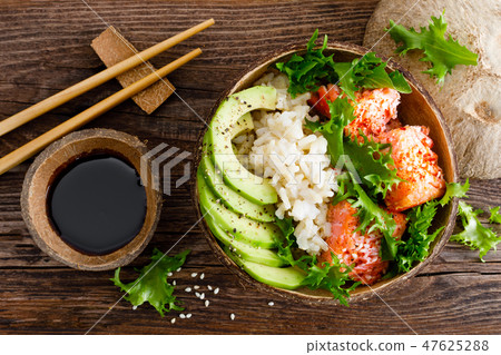 Hawaiian poke coconut bowl with grilled salmon Hawaiian poke coconut bowl with grilled salmon 47625288