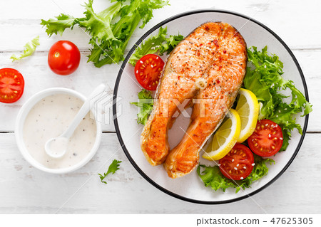 Salmon fish steak grilled and vegetable salad Salmon fish steak grilled and vegetable salad 47625305