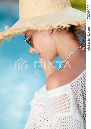 Fashion beautiful woman on summer vacation relaxing at luxury re Fashion beautiful woman on summer vacation relaxing at luxury re 47626002