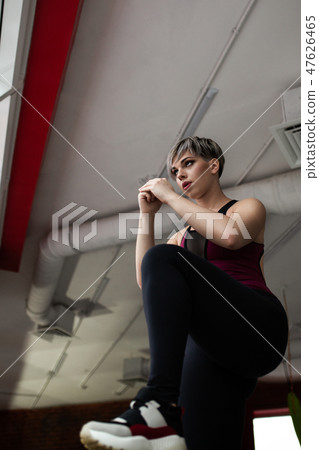 Woman with step platform doing cross fit exercise. Studio shot 47626465