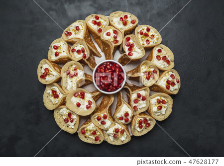 Qatayef Arabian pancake stuffed with sweet cheese. 47628177