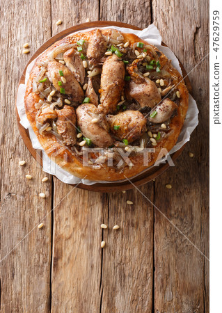 Palestinian musakhan or sumac chicken closeup Palestinian musakhan or sumac chicken closeup 47629759