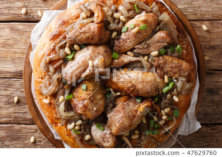 Palestinian dish of chicken with sumac, pine nuts Palestinian dish of chicken with sumac, pine nuts 47629760