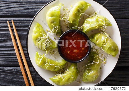 gyoza dumplings with matcha served with sauce gyoza dumplings with matcha served with sauce 47629872