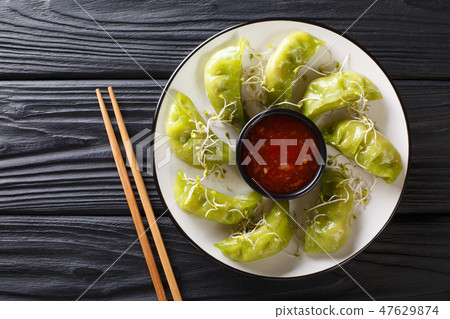 Japanese gyoza with matcha served with sauce Japanese gyoza with matcha served with sauce 47629874