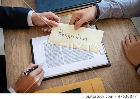 Businessman sending a resignation letter to employer boss in ord 47630877
