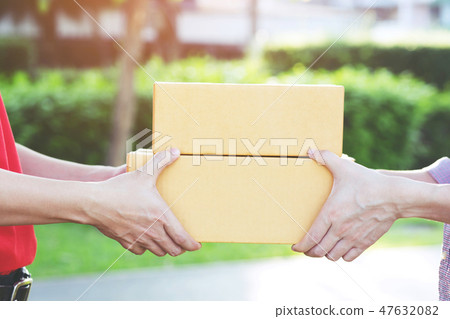 parcel delivery man of a package parcel delivery man of a package 47632082