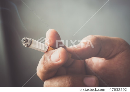 The man smoking a cigarette. Cigarette The man smoking a cigarette. Cigarette 47632292