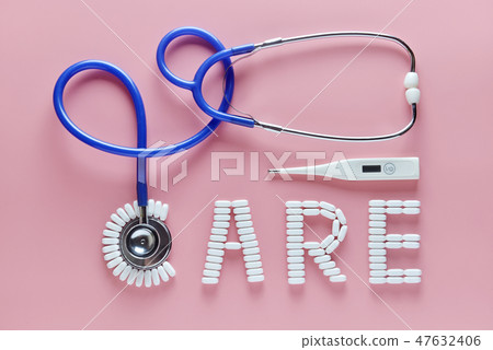 CARE word made by medicine pills, pink background. CARE word made by medicine pills, pink background. 47632406