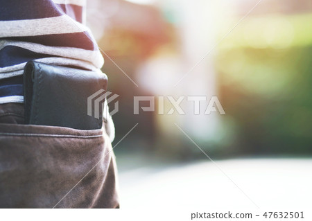 Confident man posing in save keeping your wallet 47632501