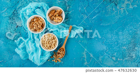 Different nuts on gray background 47632630