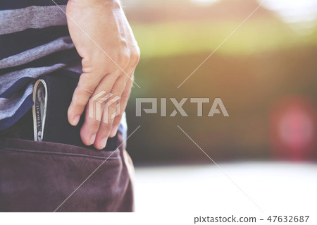 Confident man posing in save keeping your wallet  47632687