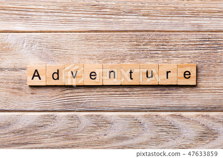 adventure word written on wood block. adventure word written on wood block. 47633859