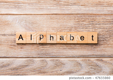 alphabet word written on wood block.  47633860
