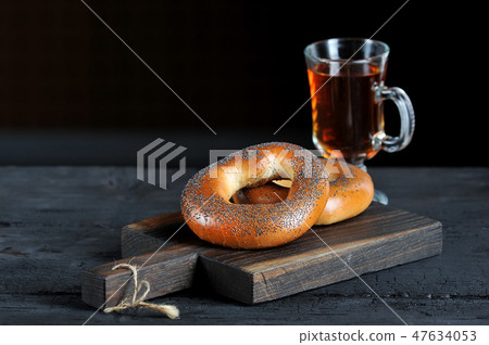 bagels with poppy seeds on a wooden Board 47634053