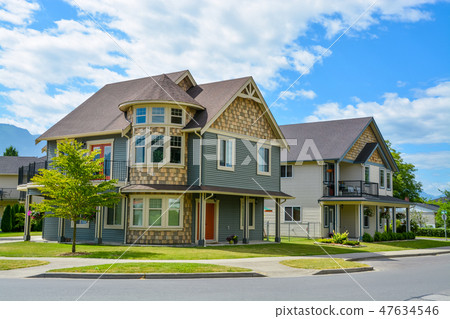 Luxury family house on cloudy, blue sky background in British Columbia, Canada. Luxury family house on cloudy, blue sky background in British Columbia, Canada. 47634546