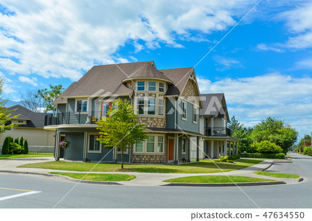 Luxury family house on cloudy, blue sky background in British Columbia, Canada. 47634550