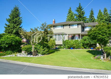Nicely decorated front yard of family house Nicely decorated front yard of family house 47634552