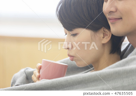 Couple tea time warmth 47635505