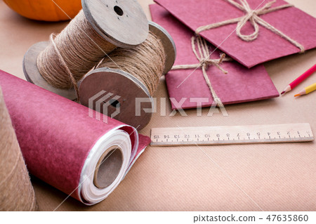 Gift wrapping set on pink. A set of items for gift decoration. Flat lay side view Gift wrapping set on pink. A set of items for gift decoration. Flat lay side view 47635860