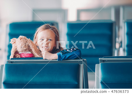 Little kid in airport waiting for boarding 47636373