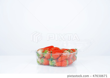 Plastic box with strawberries on white background. Plastic box with strawberries on white background. 47638671