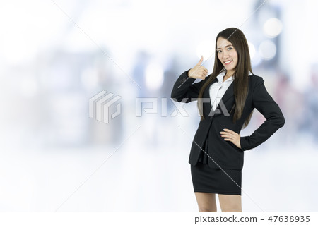 Smiling asian young business woman with thumb up. Smiling asian young business woman with thumb up. 47638935