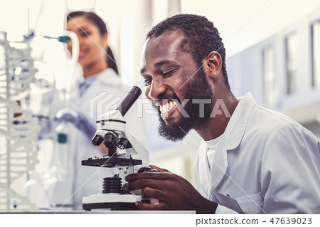 Young microbiologist feeling extremely happy 47639023